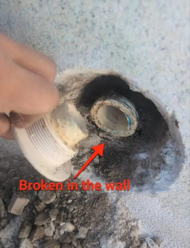 Return fitting with an arrow showing where it broke in the wall