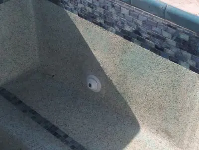 Pool wall patched around a new return fitting