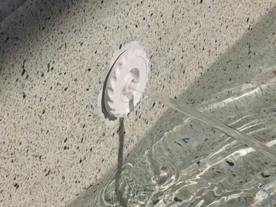 Spa jet with an epoxy patch around it