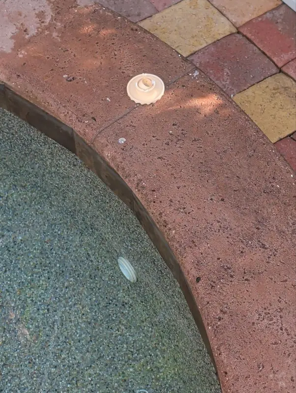 Spa floor and bench with a jet fitting
