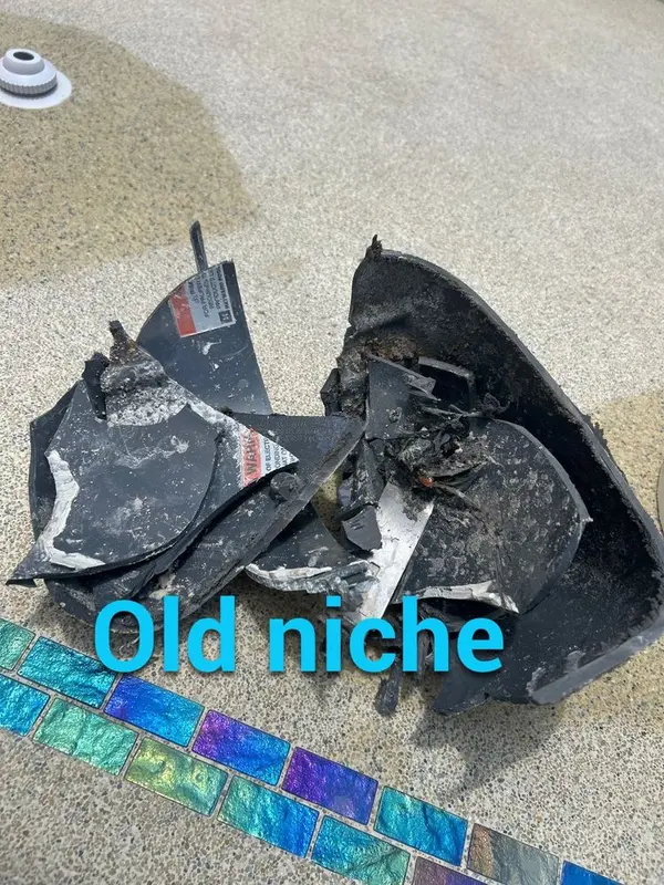 Pieces of an old brittle pool light niche
