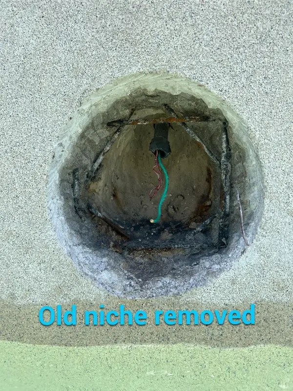 Opening in the pool wall where the light niche was removed