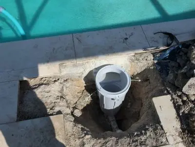 Old skimmer dug out from under a travertine deck