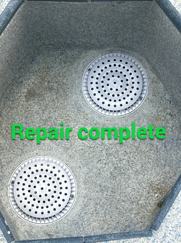 Two spa main drain covers back in place after the repair