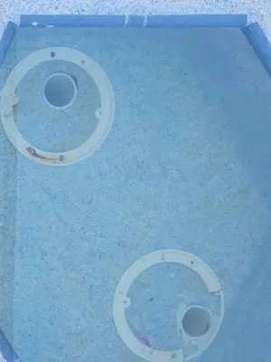 Two main drains in the floor of a spa