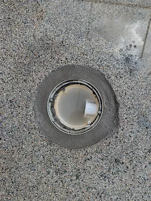 Main drain with a fresh patch around it
