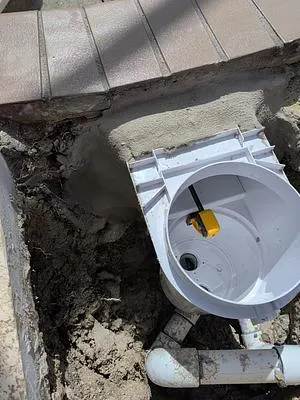New skimmer set in hydraulic cement at the pool wall