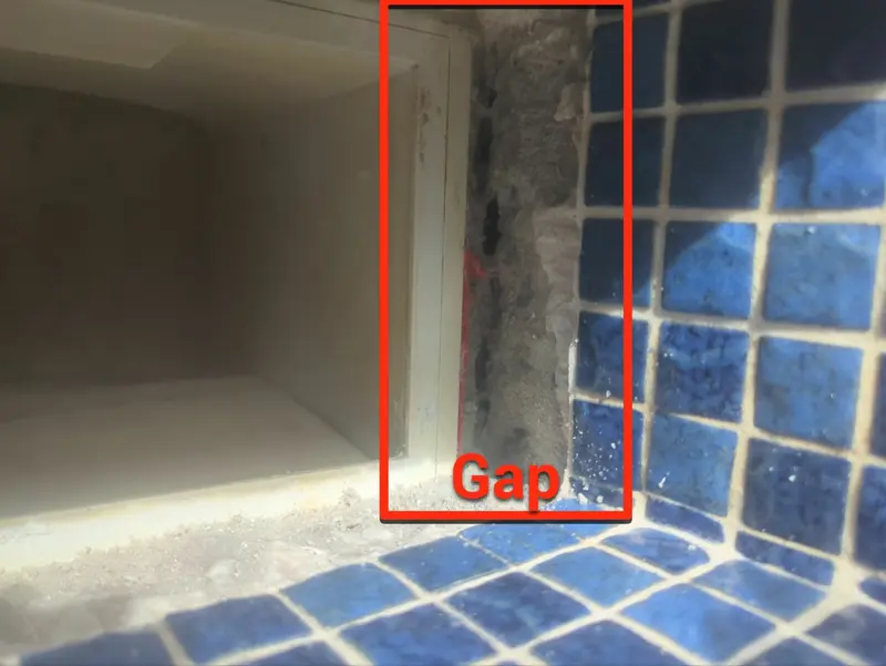 Skimmer throat with a gap marked between the skimmer and tile