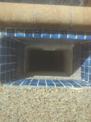 Refinished skimmer throat below blue tile