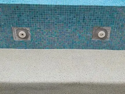 Spa jets in glass tile after the patch
