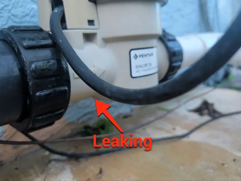 Salt cell on the pool plumbing with an arrow showing where it is leaking