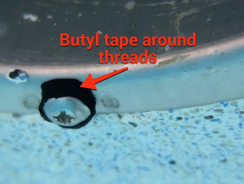 Light niche screw hole wrapped with butyl tape
