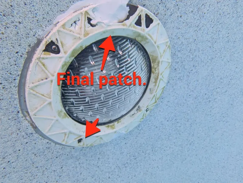 Pool light reinstalled with epoxy patches at the screw holes
