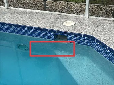 Pool wall below the skimmer with the crack area boxed in red