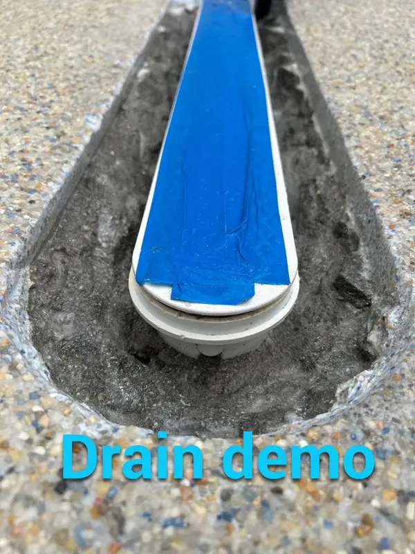 Slot main drain with old finish removed around it