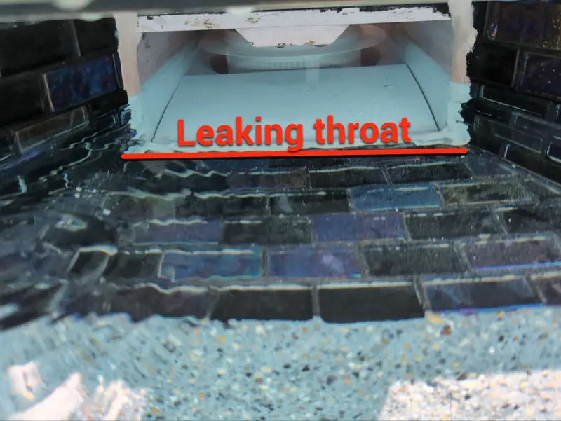Skimmer throat with a red line marking the leak