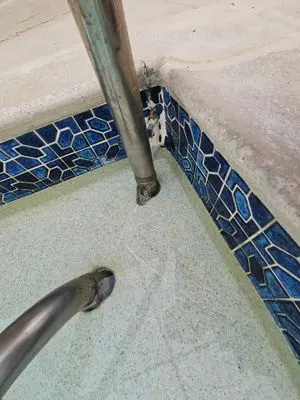 Pool step corner and handrail with old epoxy