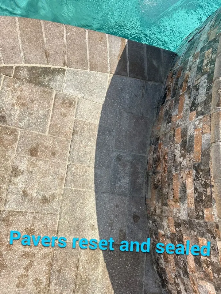 Pool deck pavers reset and sealed after a plumbing repair in St. James City