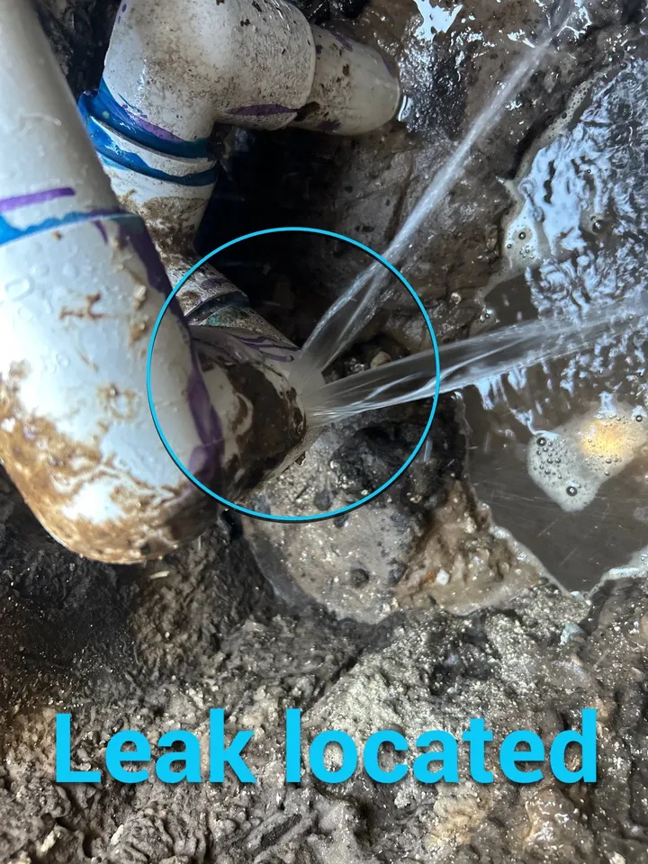 Water spraying from a broken return line fitting under a pool deck in St. James City